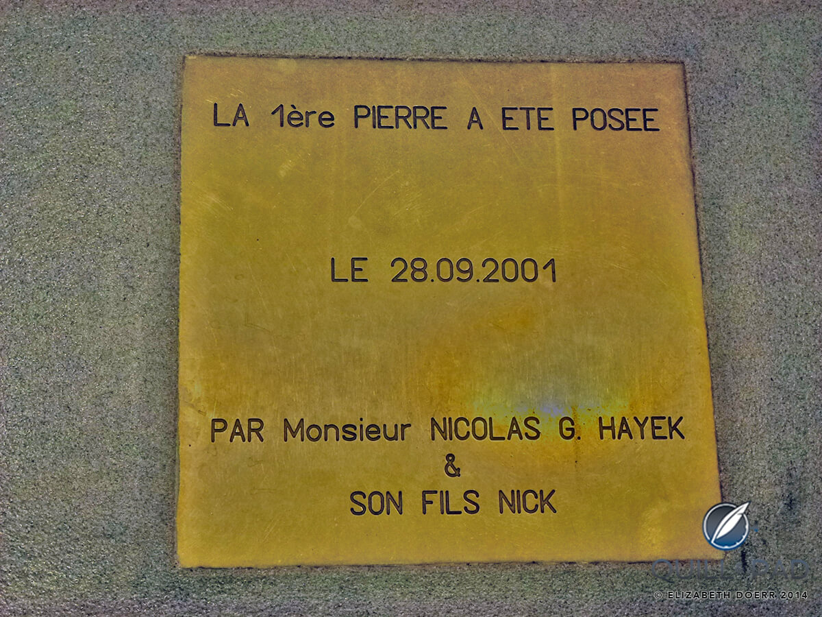 Commemorative plaque in floor outside new annexe to the manufacture: