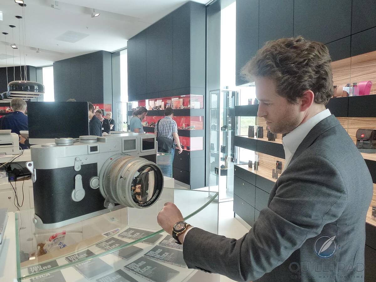 Côme de Valbray comparing the Valbray EL 1 Chrono with it's inspriation, a Leica camera. Image courtesy Olga Corsini
