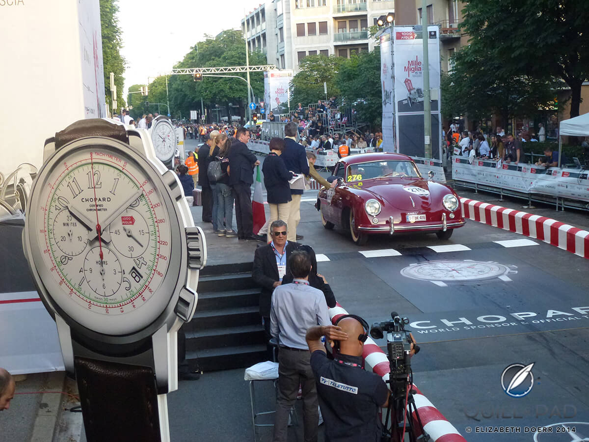 Roland Iten and Joop de Hoogh driving a 1953 Porsche 356 Pre A Coupé 1500 over the start line of the 2014 Mille Miglia in Brescia, Italy