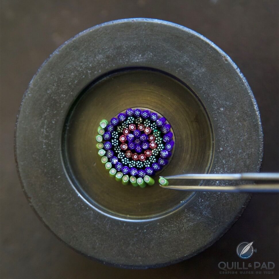 Arranging baguettes (cut lengths of cane) to create a Millefiori crystal