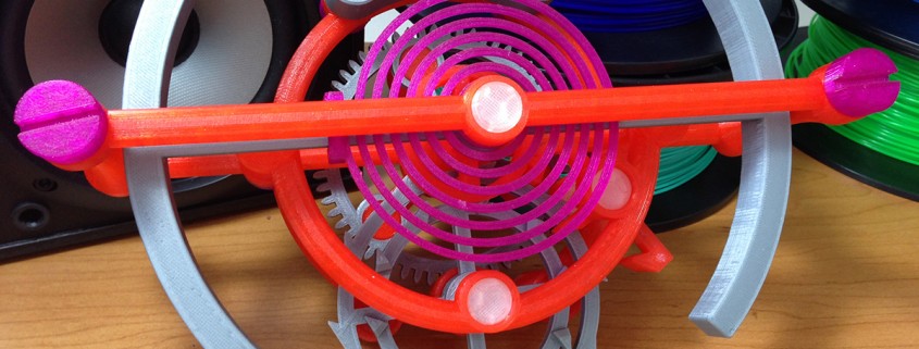 Brightly colored model of a tourbillon escapement designed by Nicholas Manousos