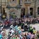 The 2014 Tour de France riding past the Chronophage clock at Corpus Christi College Cambridge