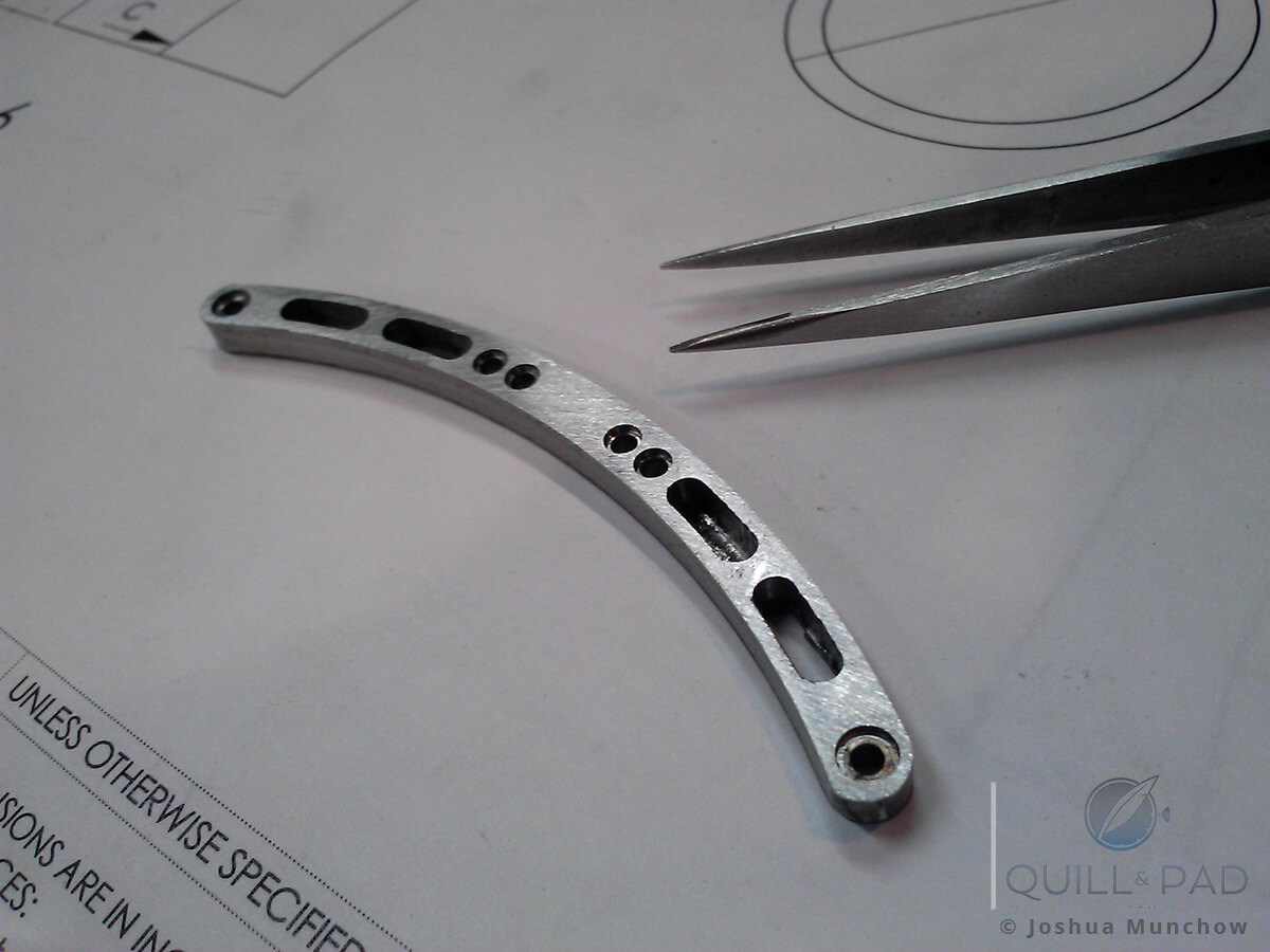 Rough milled articulating lugs in one piece, halfway done