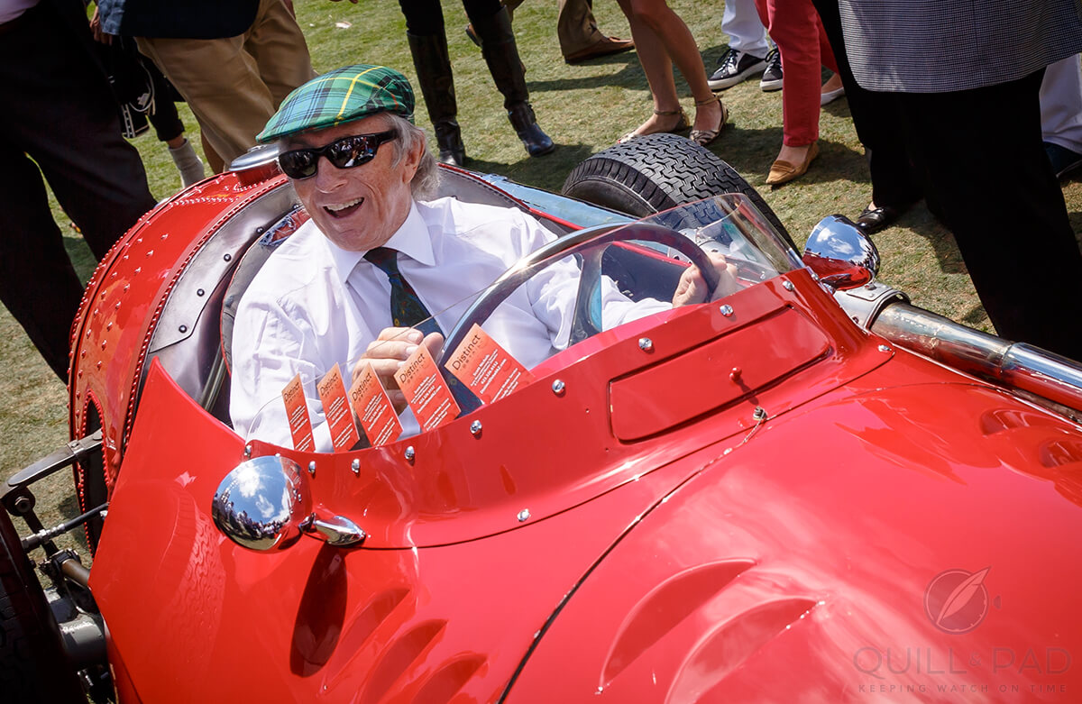 Sir Jackie Stewart in a 1955 Maserati 250F Monoposto at the 2014 Pebble Beach Concours d'Elegance