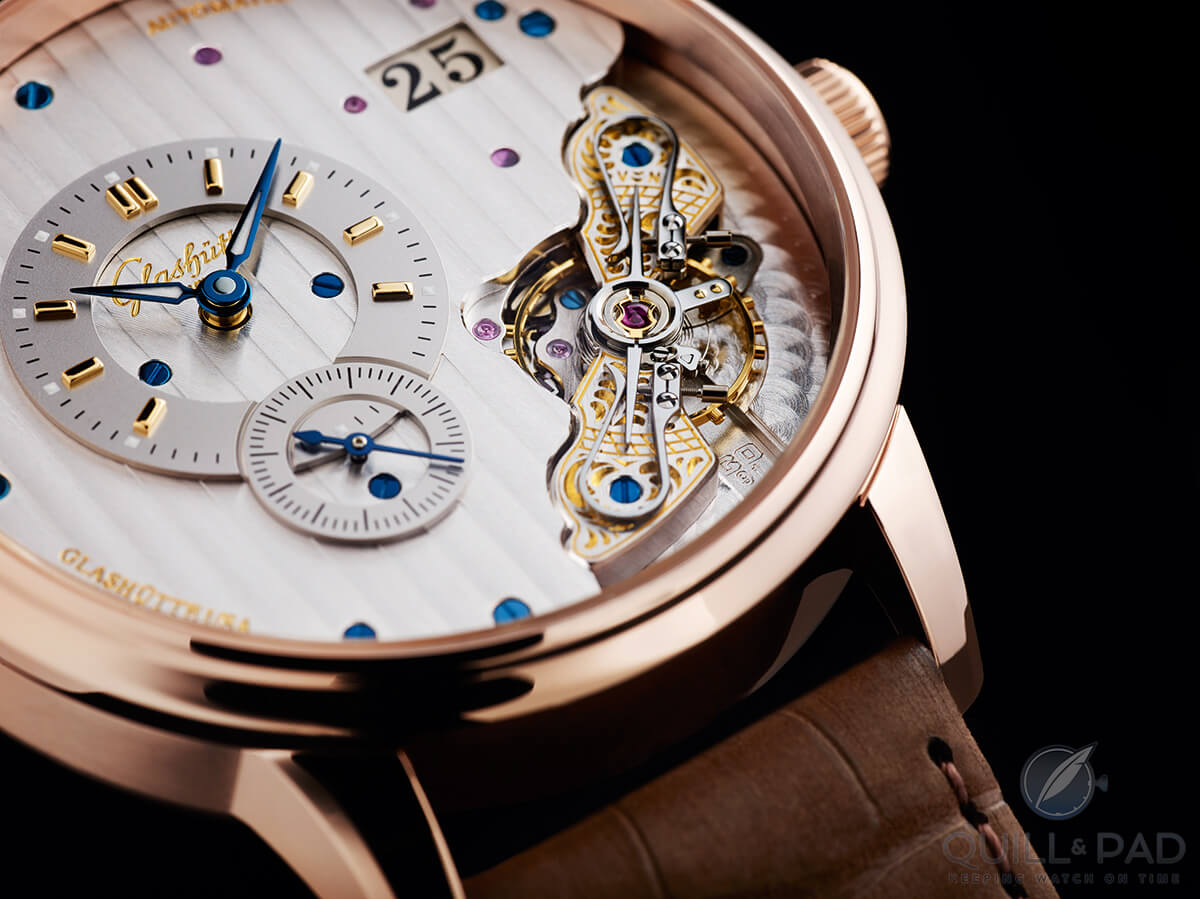 The beautifully engraved balance bridge and mirror polished swan neck regulator of the Glashütte Original PanoMaticInverse