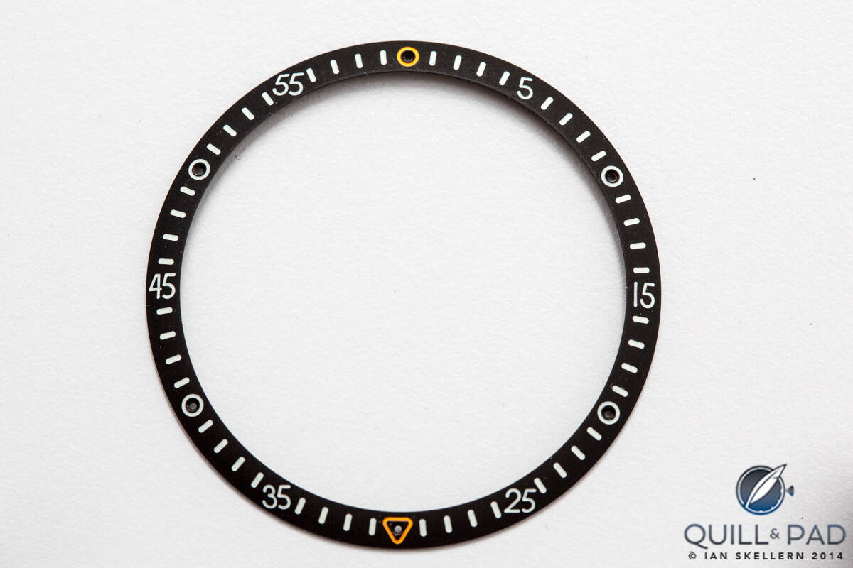 The minute chapter ring which circles the dial of the Ressence type 3. The small orange arrow at the bottom points to the date