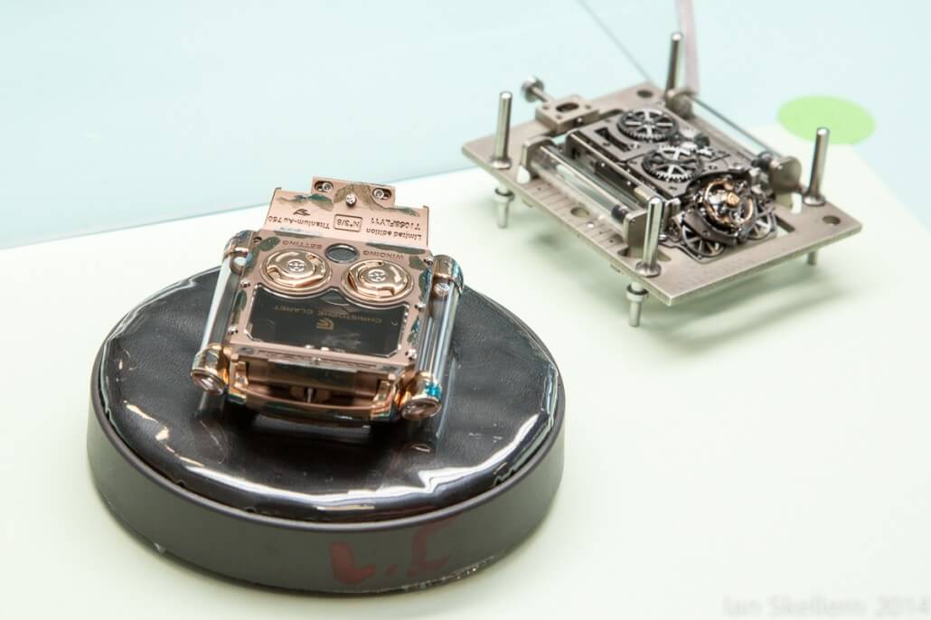 Christophe Claret X-TREM-1 case (upside down) on left and movement in support frame on right