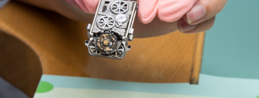 Carefully placing the movement of the Christophe Claret X-TREM-1 into its case from the back