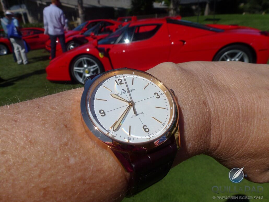 Jaeger-LeCoultre Geophysic 1958 on the wrist with a gaggle of Ferraris behind it