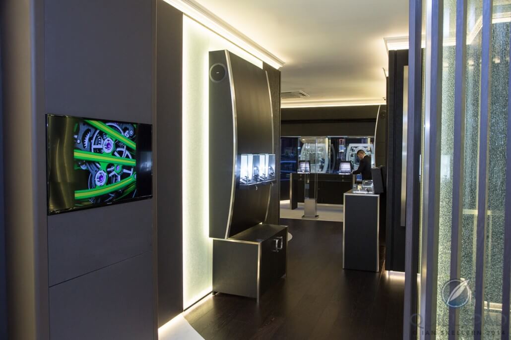 Inside London's Richard Mille boutique looking toward the front; note the curved shape of the display cases