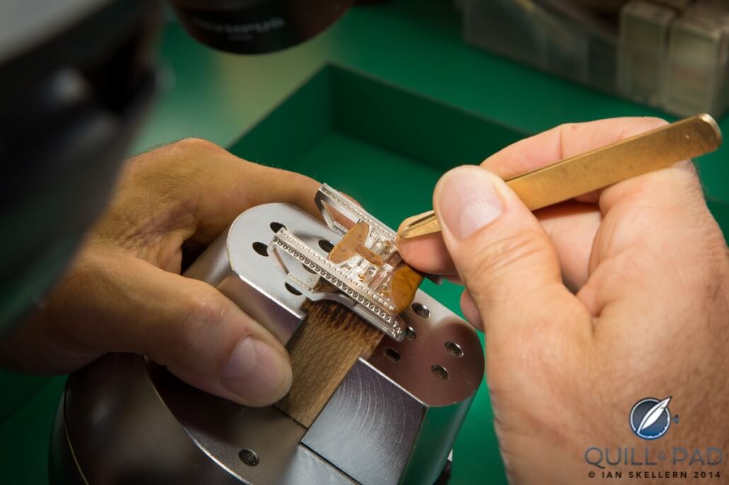 Meticulously setting diamonds into the full-pavé Caliber R822 Predator buckle