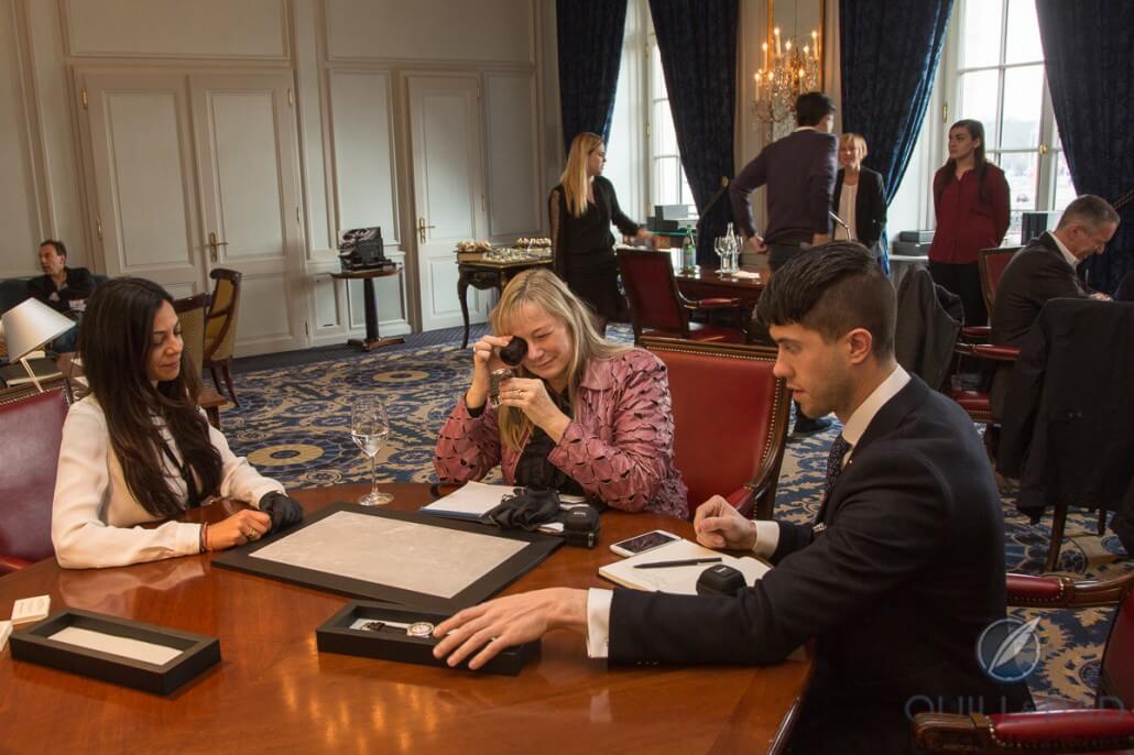 De Bethune communication director Katidja Valy (left) showing the new collection to Quill & Pad's Elizabeth Doerr and Joshua Munchow