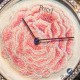 Thousands of silk stitches do into hand embroidering the Piaget Altiplano Rose dial