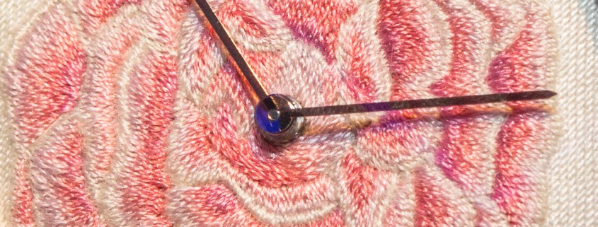 Thousands of silk stitches do into hand embroidering the Piaget Altiplano Rose dial