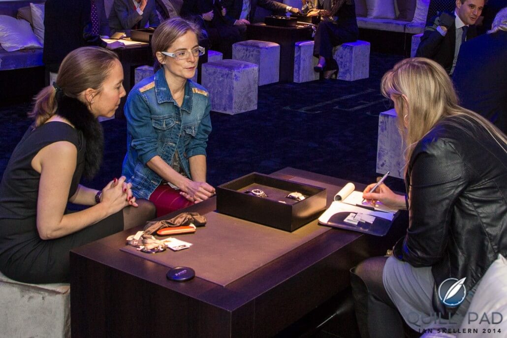 Interviewing needlework artisan Sylvie Deschamps (center) at the Piaget stand at the 2014 SIHH