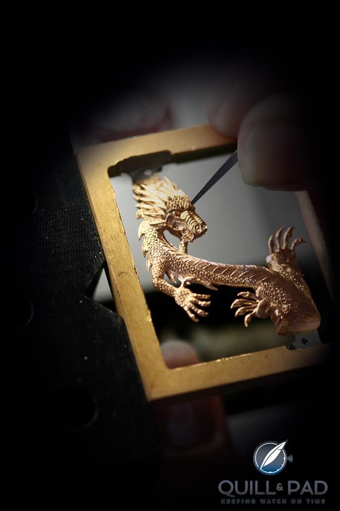Carefully engraving a gold Corum dragon