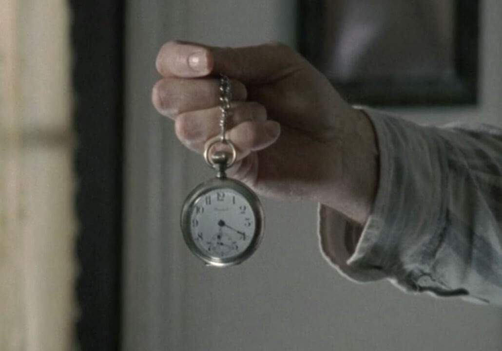 Herschel Greene (Scott Wilson) gives Glenn Rhee (Steven Yeun) his prized pocket watch in 'The Walking Dead'