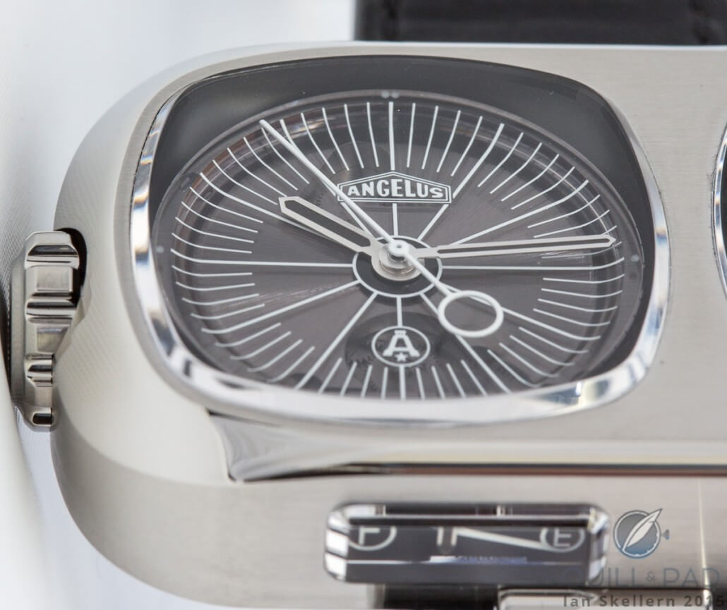 The smoked-sapphire dial of the Angelus Tourbillon Lumière is concave; the power reserve indicator is just visible on the case band