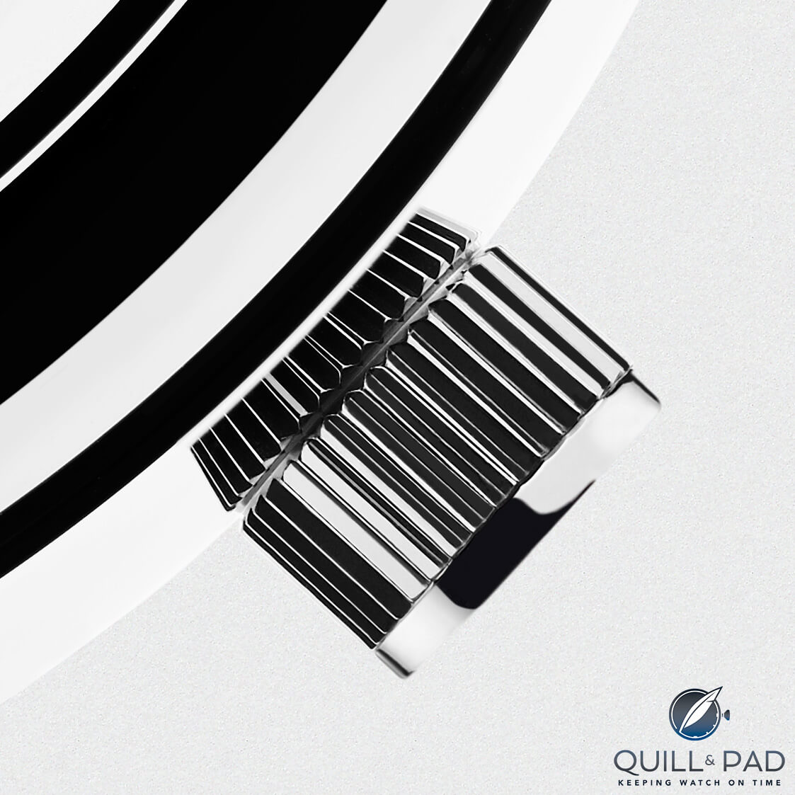 The alarm winder/activator is discreetly concealed flush in the crown