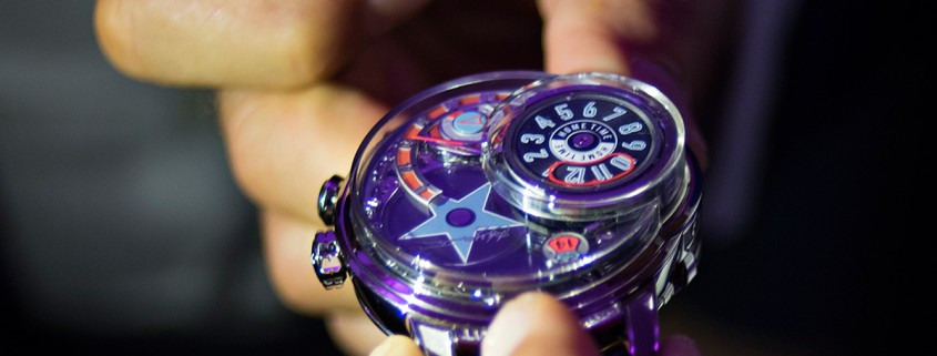 The star logo of the Harry Winston Opus 14 fully deployed and second time zone fully hidden