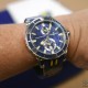 The light reflections on the deep blue dial reveal the embossed little sailboats on the Ulysse Nardin Marine Diver Artemis Racing