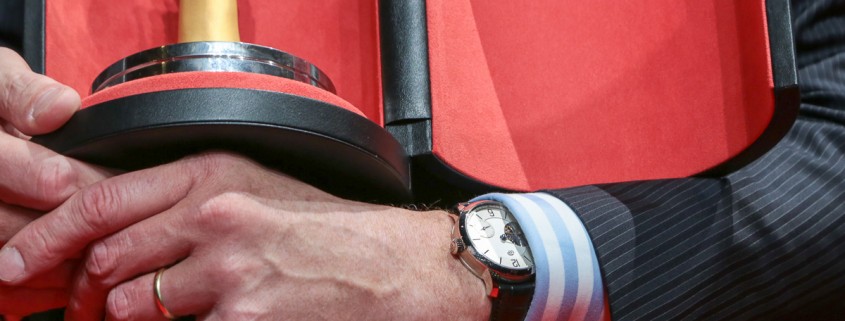Stephen Forsey at the 2015 Grand Prix d’Horlogerie de Genève with the Aiguille d'Or in one hand and a Greubel Forsey Tourbillon 24 Secondes Vision on the other