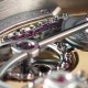 Ruby slippers: movement detail showing ruby bearings on constant torque chain of the Romain Gauthier Logical One