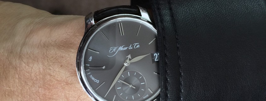 H. Moser & Cie Endeavour Perpetual Calendar in platinum on the wrist of U2 bassist Adam Clayton