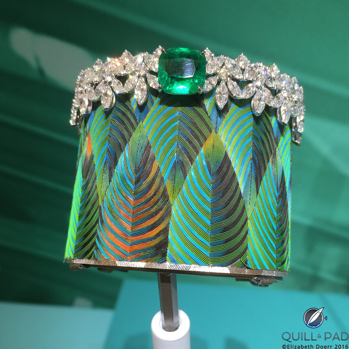 One-of-a-kind Piaget Sunny Side of Life feather marquetry cuff topped off by a square-cut tourmaline