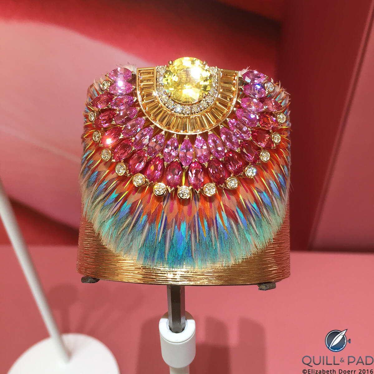 One-of-a-kind Piaget cuff’s unique feather marquetry crowned by an exquisite non-heat-treated yellow sapphire framed by baguette-cut spessartites and marquise-cut pink sapphires