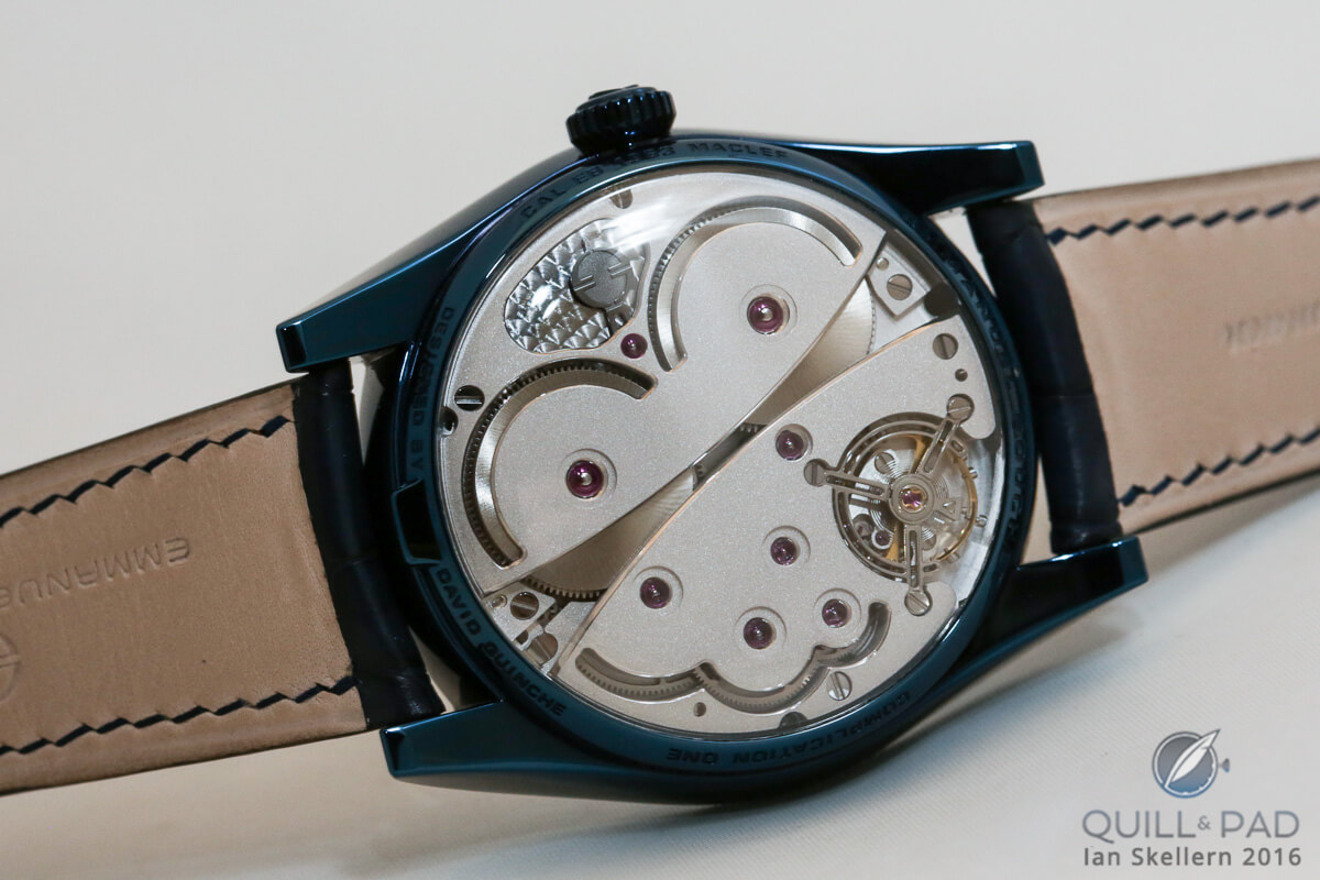 View through the curved display back to the curved movement of the Emmanuel Bouchet Complication One Blue