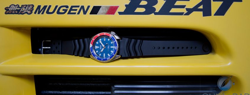 Seiko 7002 Diver nestled in an air vent of the author's Honda Mugen Beat