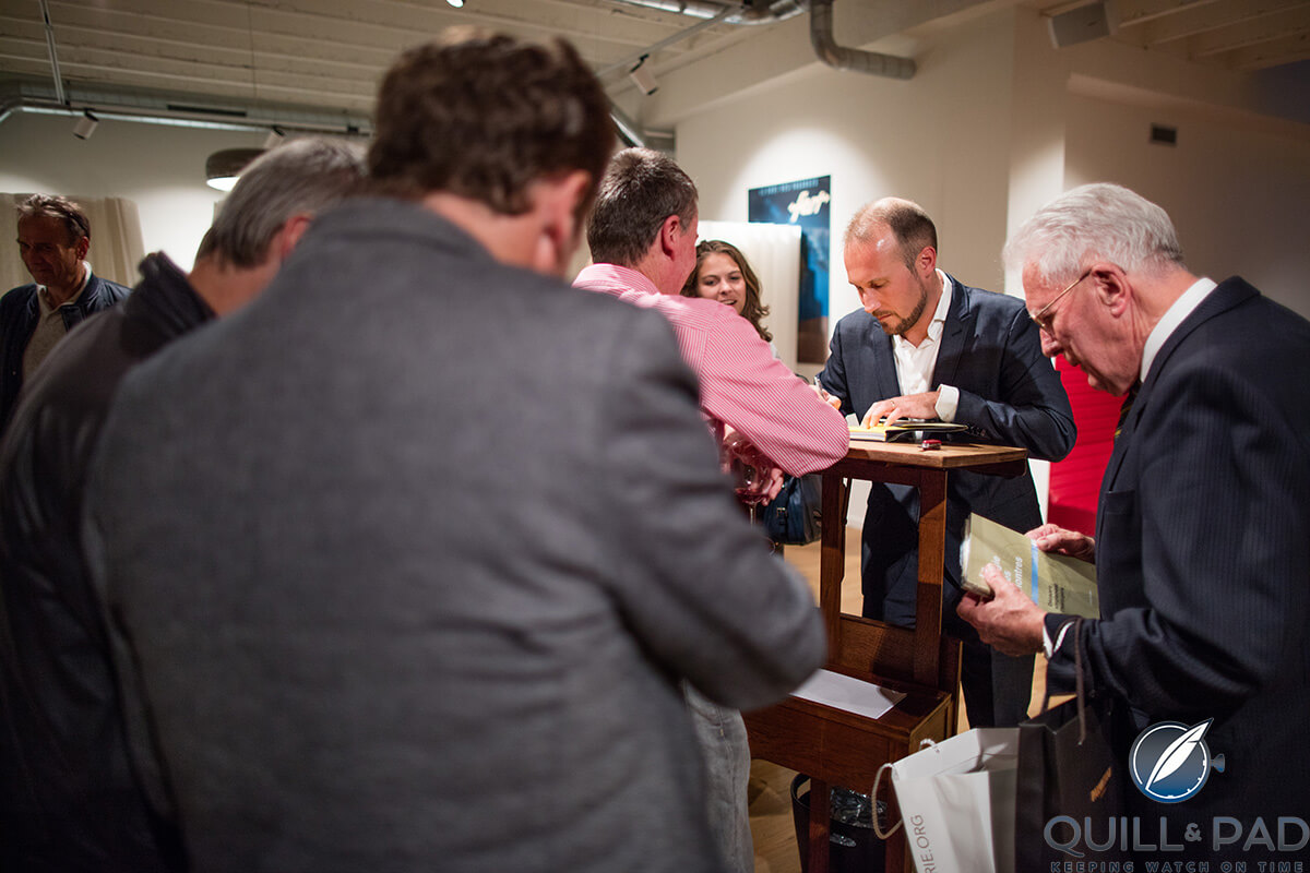 Louis Nardin signing a copy of Ian Skellern's copy of ‘The Magic of Watches’