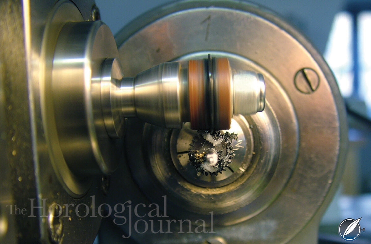 Lignum vitae lap polishing the third wheel pinion indexed in the lathe of Derek Pratt's H4 reconstruction (photo courtesy British Horological Journal)