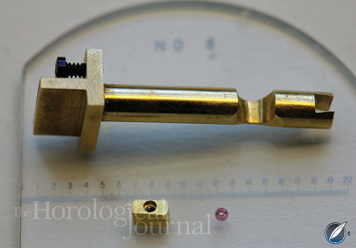  Escape counter-potance jewel hole and slide. The cut-out in the cylindrical counter-potance is to clear the fourth wheel arbor (photo courtesy British Horological Journal)
