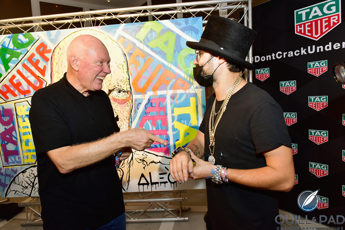 Jean-Claude Biver and Alec Monopoly in front of the graffiti portrait of Biver