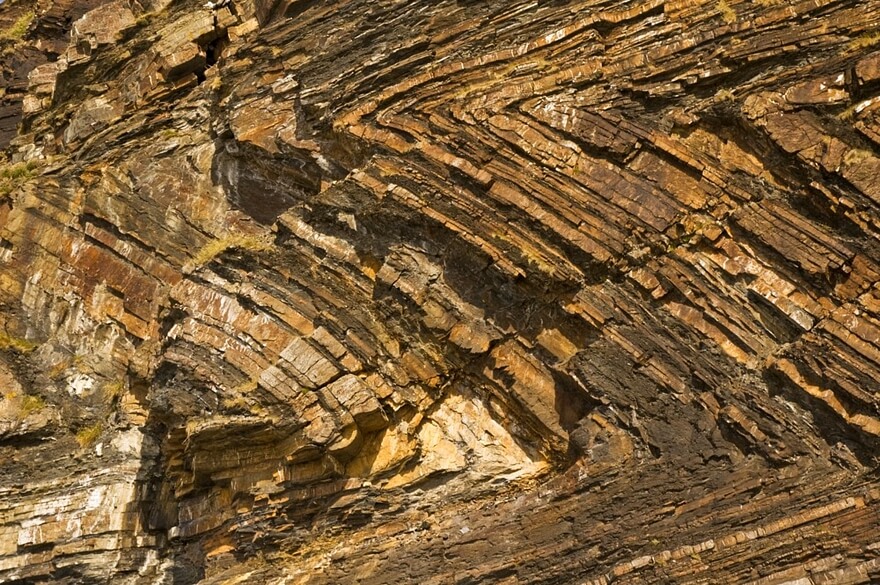 Contorted strata in the cliffs at Millook, North Cornwall (photo courtesy Smalljim/Wikipedia)