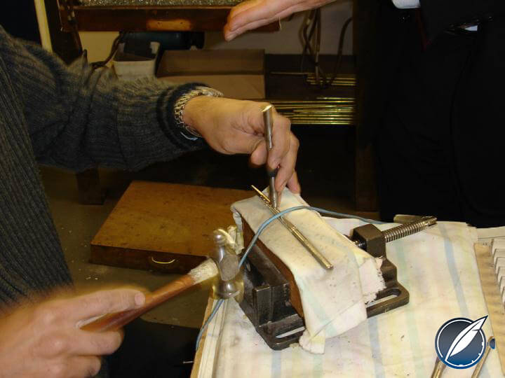 Hammering the Victorian pattern on a pencil body at Yard-O-Led