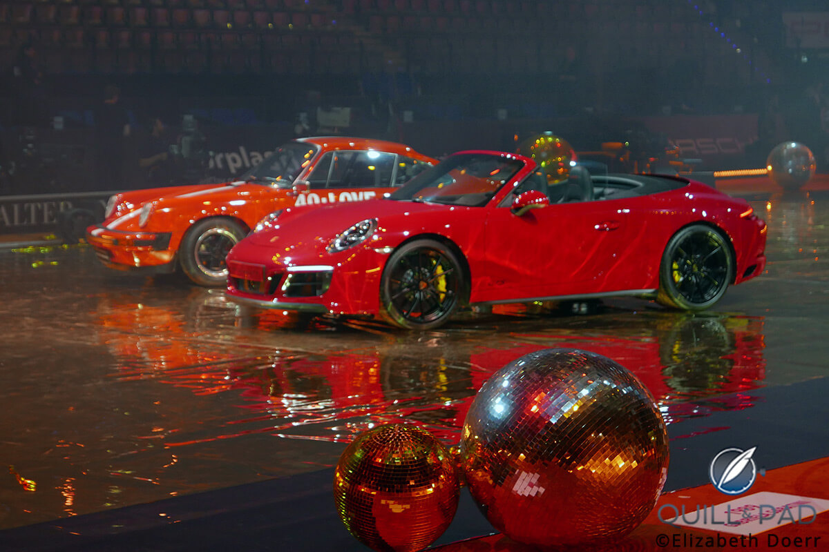 The Porsche 924 model Tracy Austin took home as winner in 1978 and the Porsche 911 Carrera GTS Cabriolet Laura Siegemund took home as the 2017 champion (front)