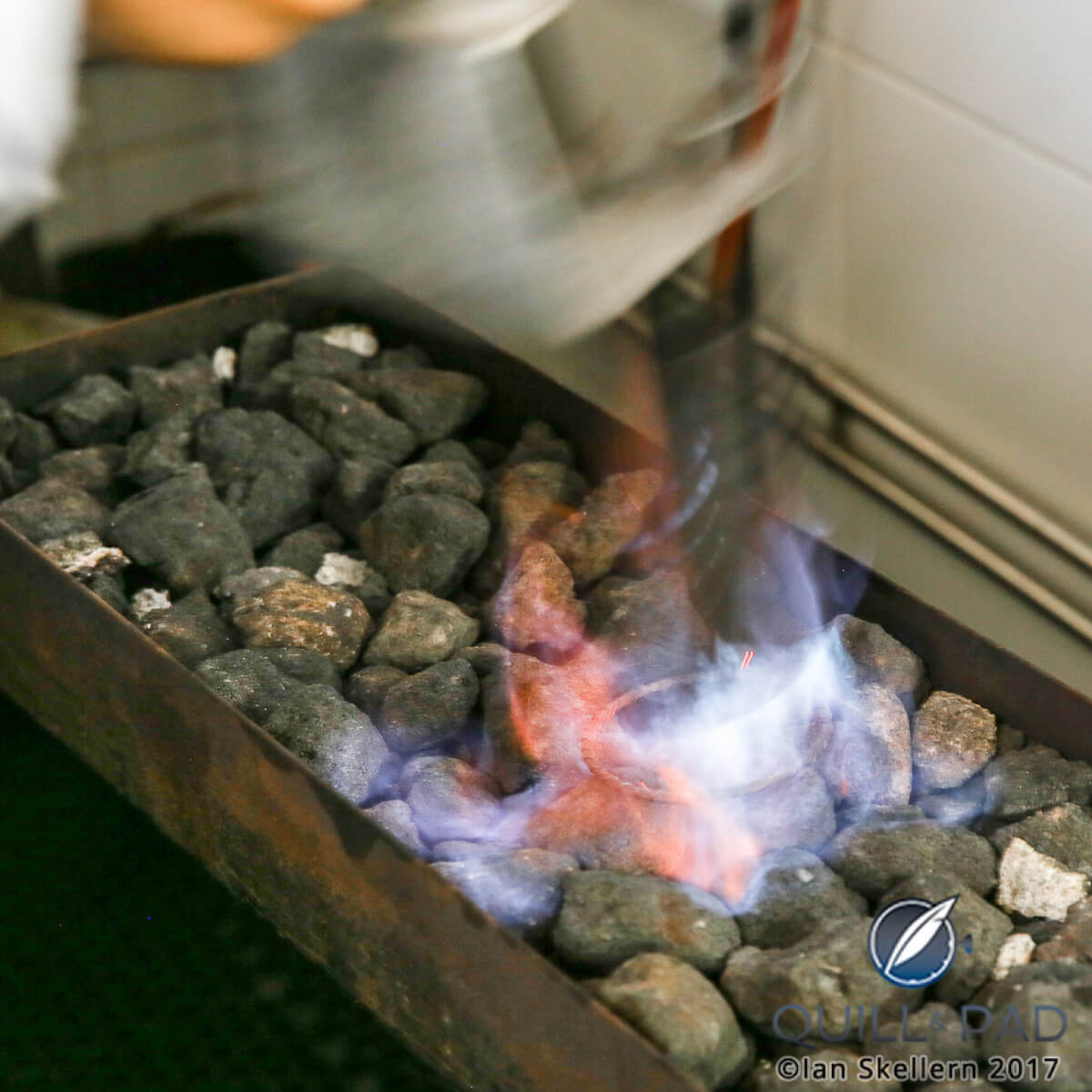 The fine 18-karat gold wire coiled and being heated in the Eleuterio workshop in Travassos, Portugal