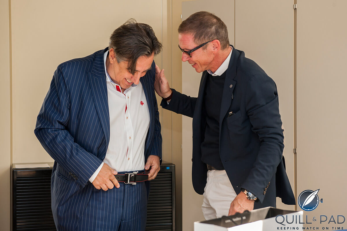 Rebellion Timepieces and Rebellion Racing team owner Alexandre Pesci (left) trying on his RR782 Flyback Pilot buckle with its inventor, Roland Iten