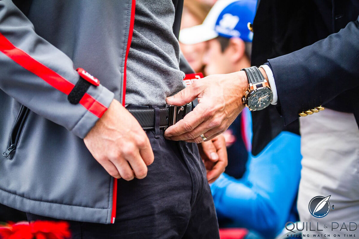 Roland Iten wearing a Rebellion watch checking the RR782 Flyback Pilot belt buckle