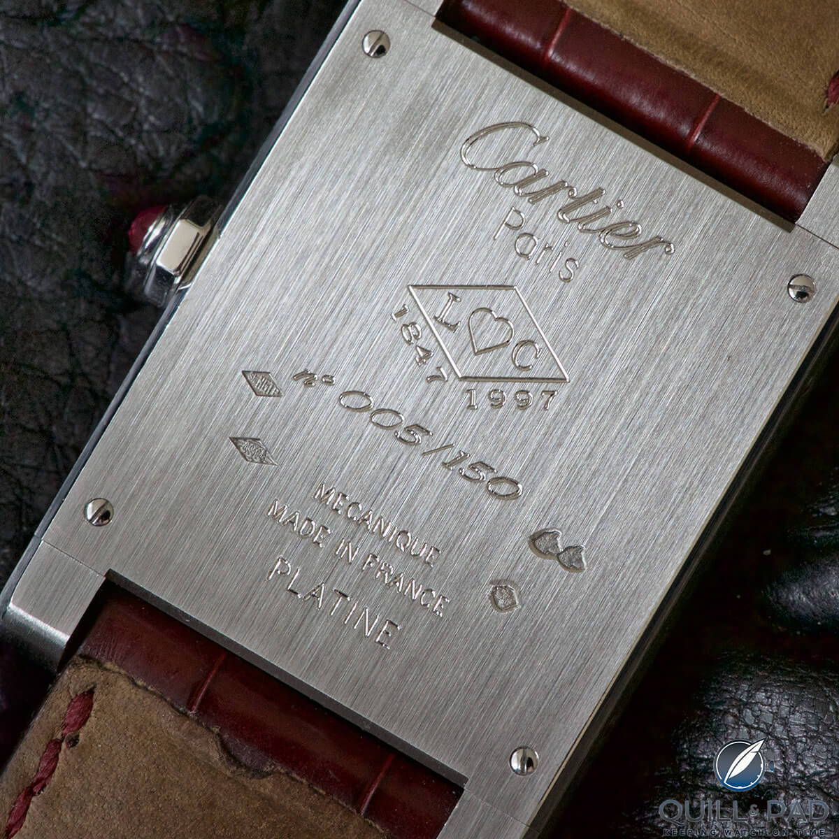 Engraved back of the Cartier Tank à Guichets in platinum