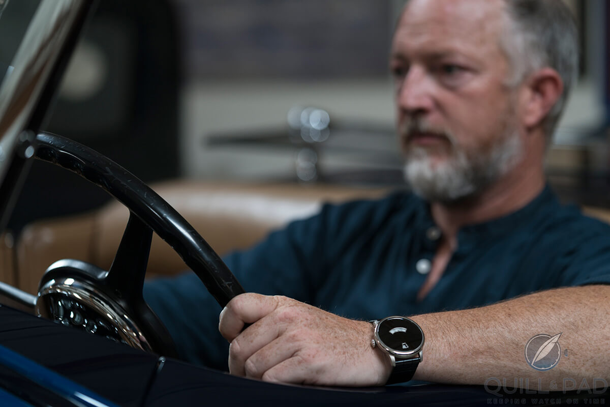 Icon 4x4 founder Jonathan Ward driving with a Duesey on his wrist