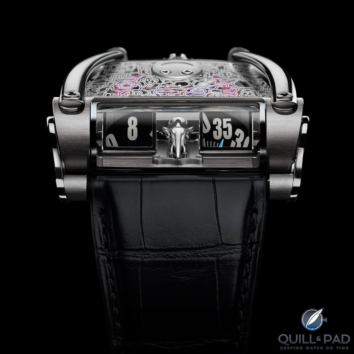 Separated by a charging (or resting peacefully) elephant the hour (left) and minute numerals (right) are actually on flat disks lying horizontally on top of the movement of MB&F HM8