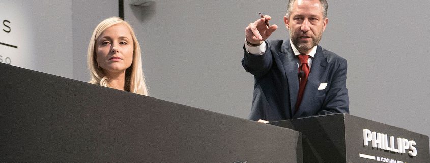Aurel Bacs of Phillips closes in on the winning bid for the Paul Newman Rolex Daytona