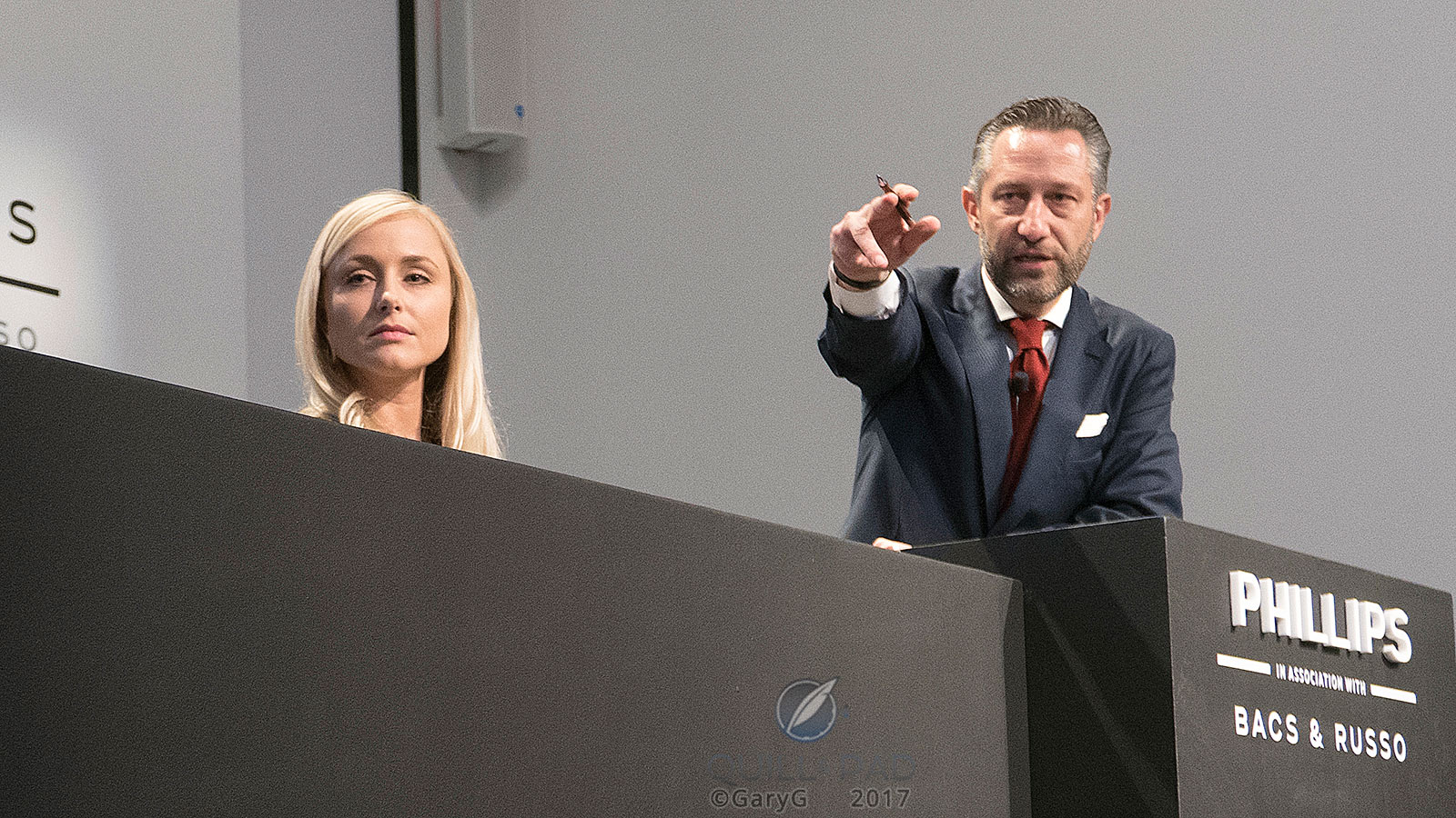 Aurel Bacs of Phillips closes in on the winning bid for the Paul Newman Rolex Daytona