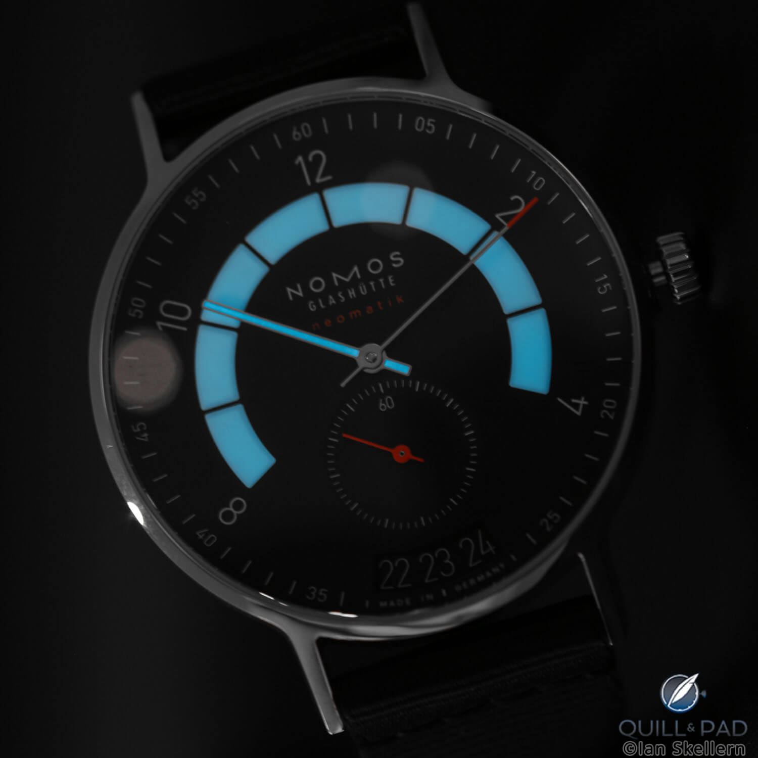Lume shot: Nomos Autobahn glowing blue in the dark