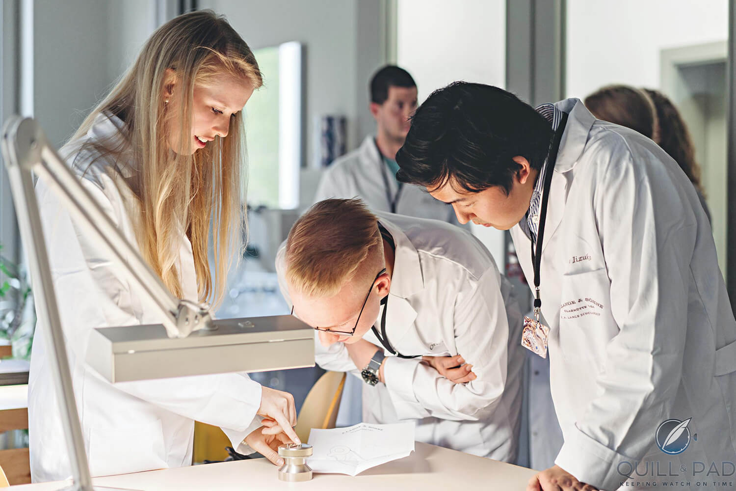 Some of the students inspecting their engraving work at A. Lange & Söhne (photo courtesy Erik Gross/A. Lange & Söhne)