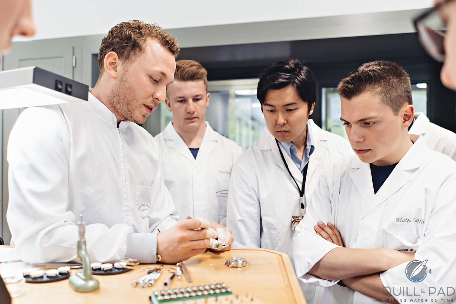 Robert Hoffmann, head of A. Lange & Söhne’s Zeitwerk department, explains some details to the contestants (photo courtesy Erik Gross/A. Lange & Söhne)